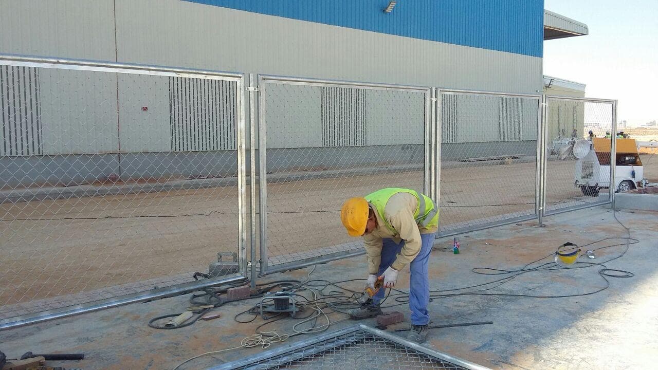 AMC Maintenance technician fabricating steel fencing on site