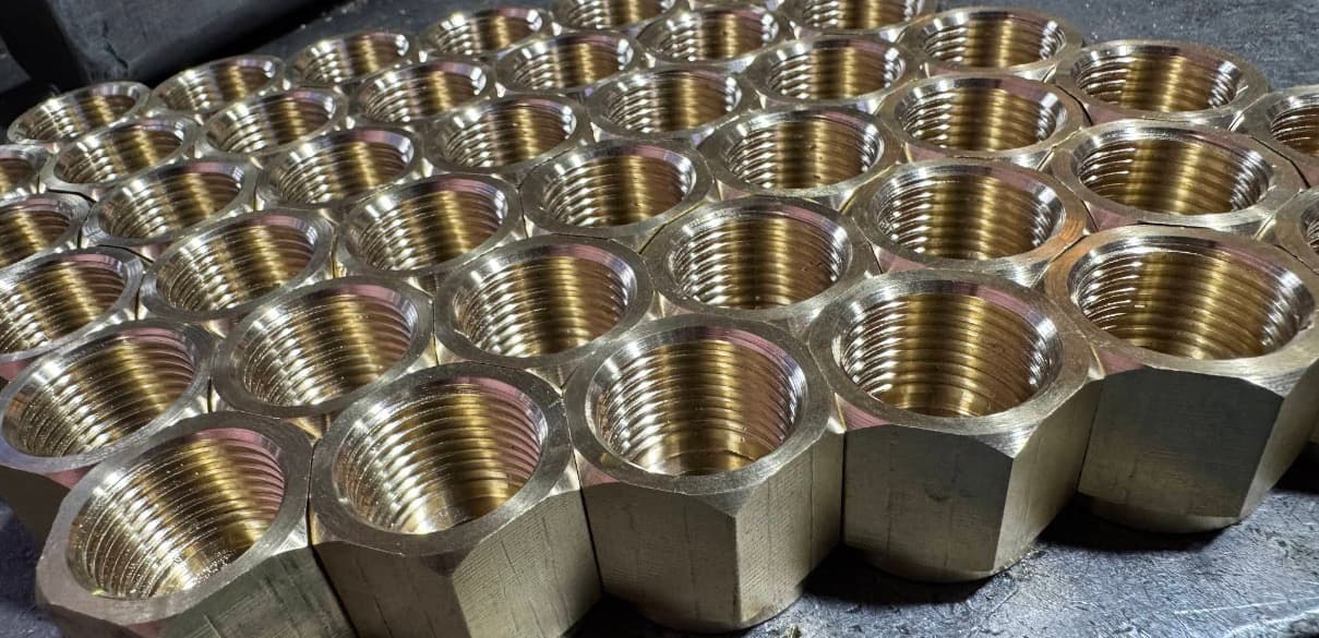 Precision-machined brass fittings produced by AMC Maintenance